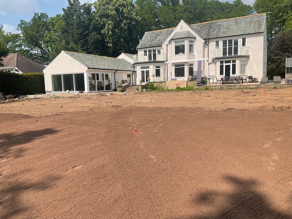 Large rear garden mid-groundworks ahead of a luxury outdoor living transformation