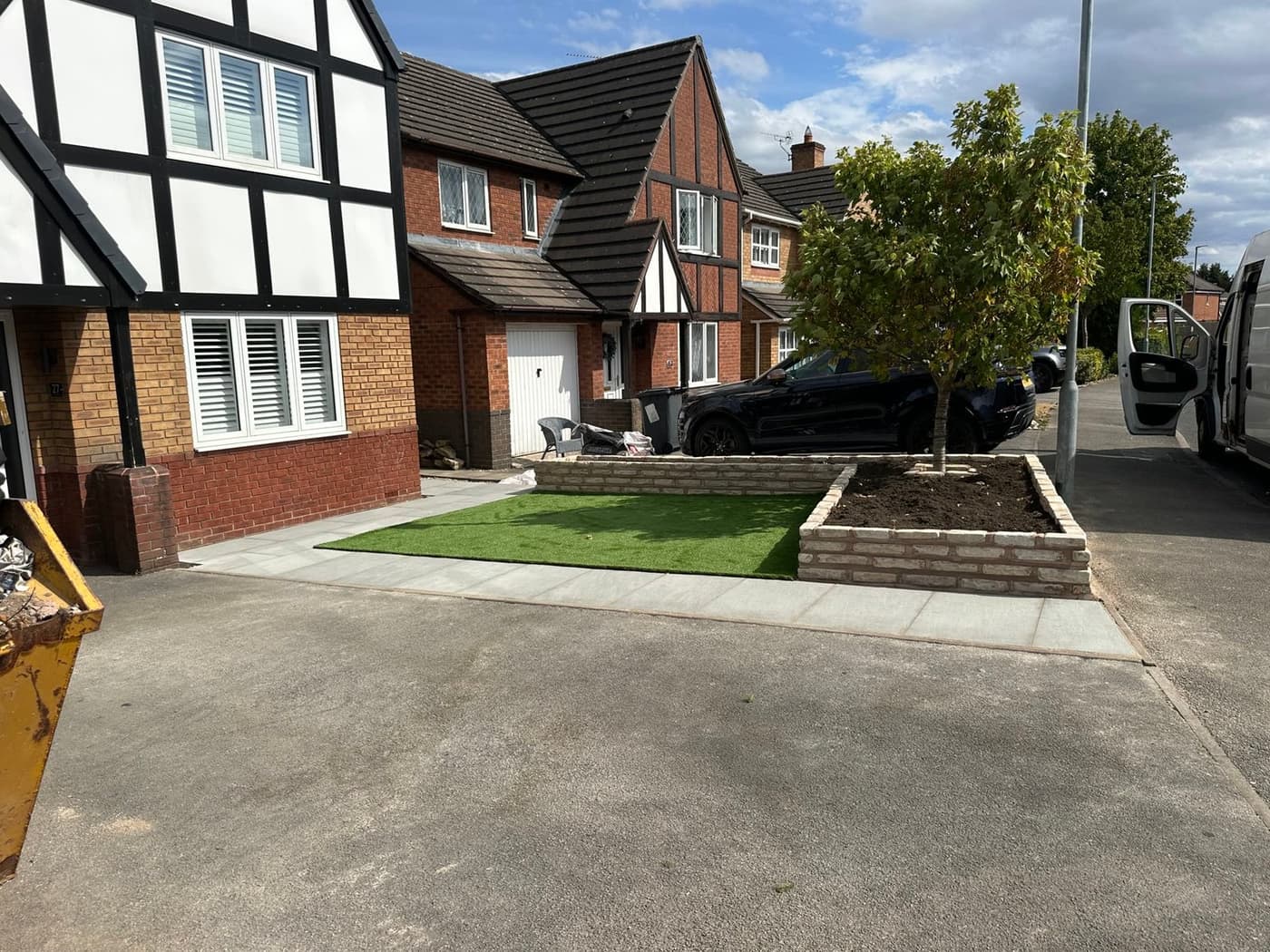 Fossil buff Indian sandstone path and artificial lawn on a maintenance-free front garden in Middlewich